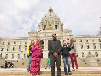 group of people on the steps of the Minnesota capitol 