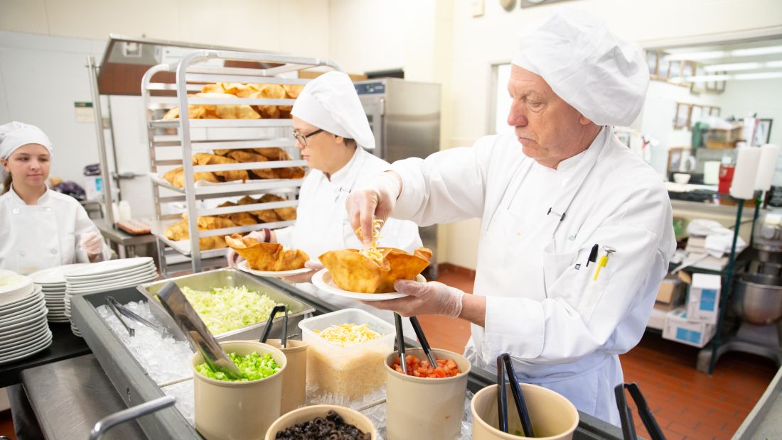 Culinary students with instructor