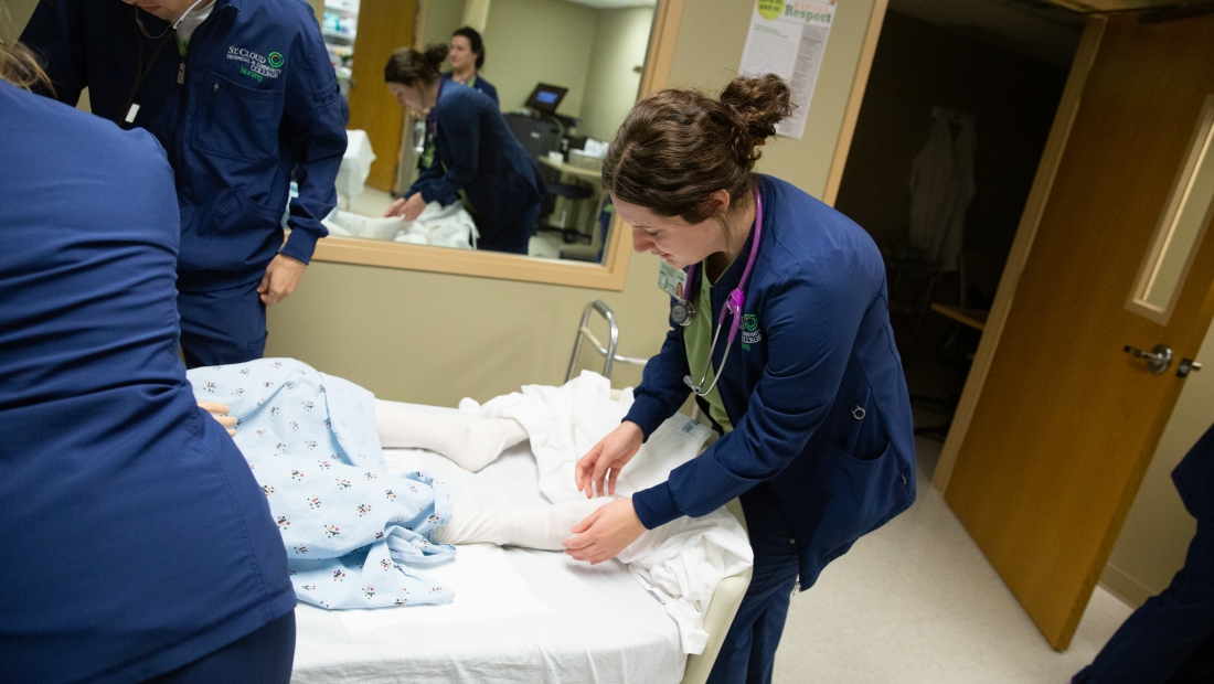 Nursing students with patient