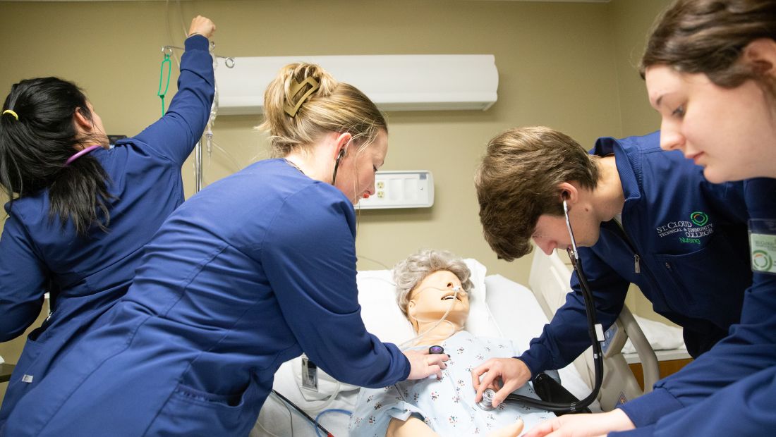 Nursing students with patient