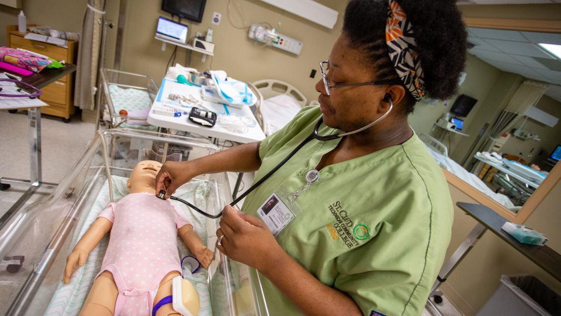 Nursing student with patient