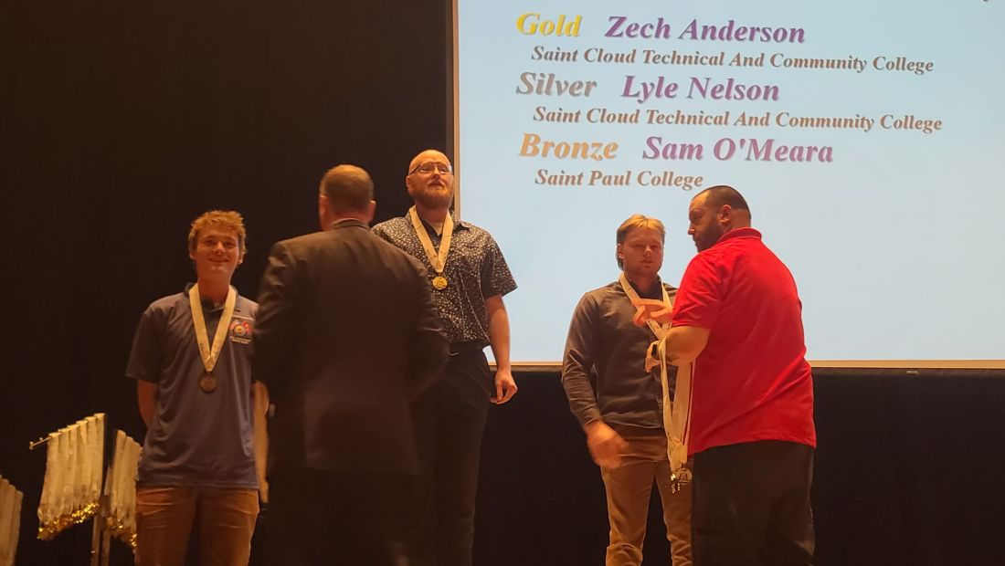 skills students on the podium getting medals