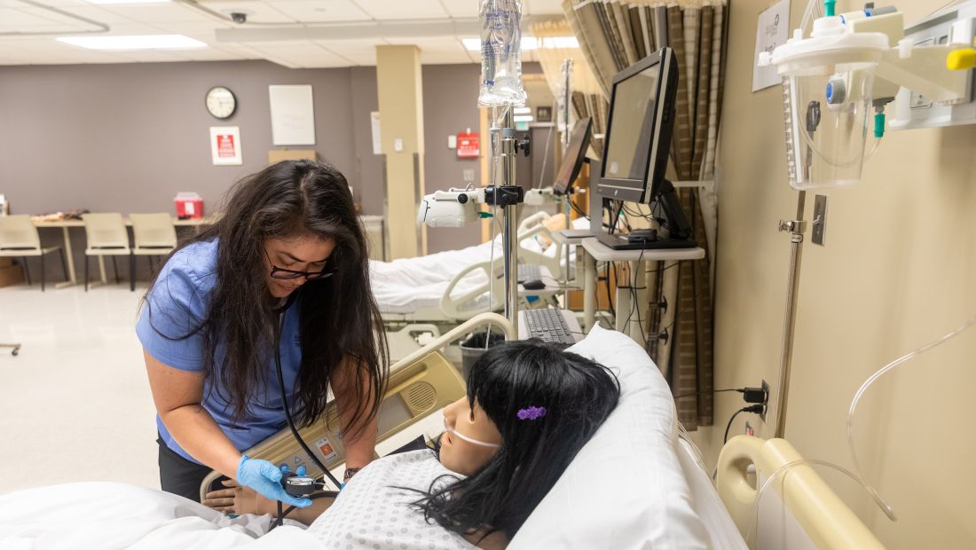 Nursing Student practices with Training Mannequin