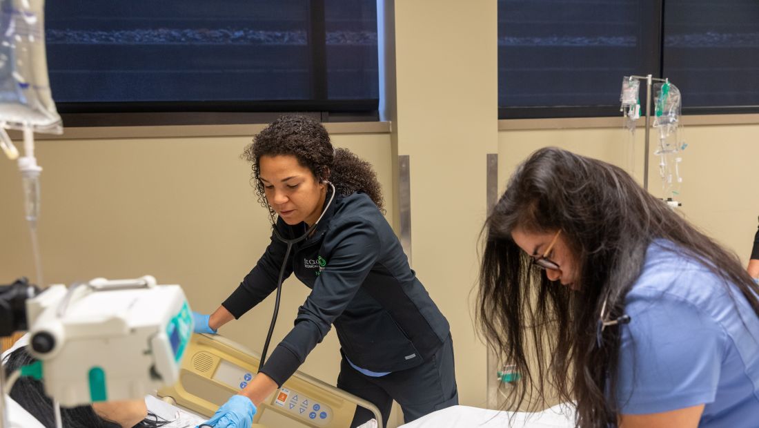 Nursing Student practices with Training Mannequin