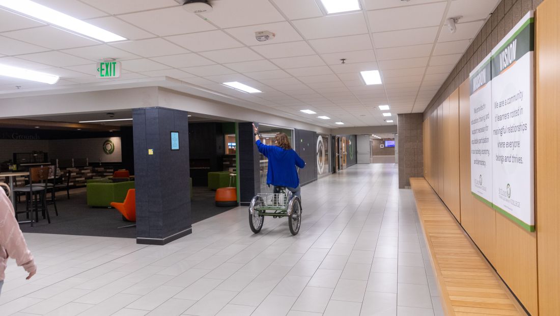 Mary, taking the bike for it's inagural ride through the hallway