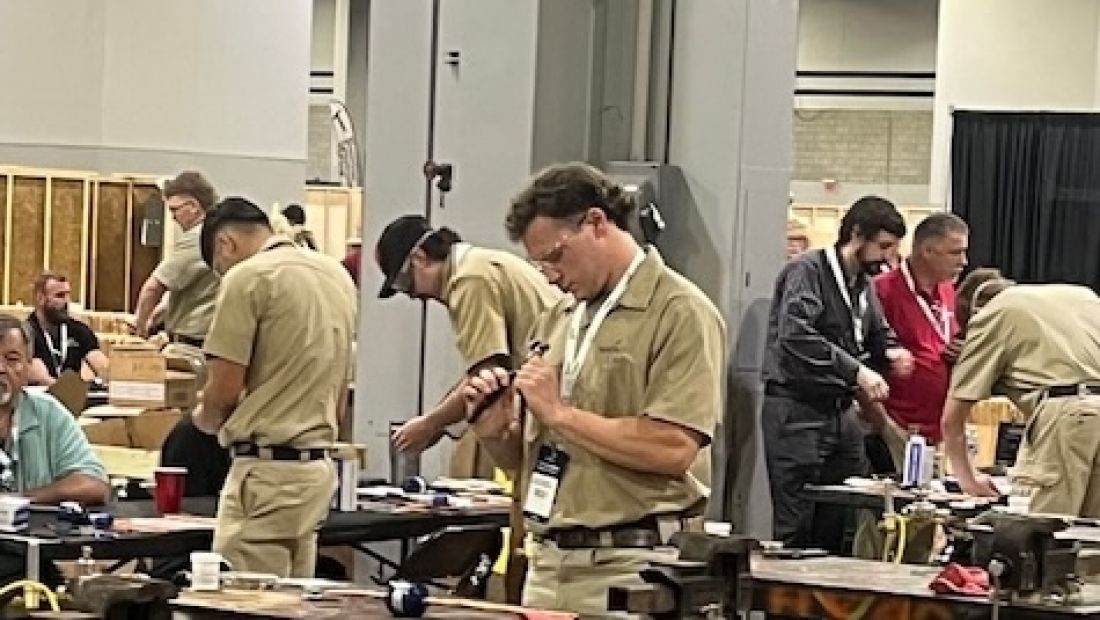 students at tables working on their skills competition
