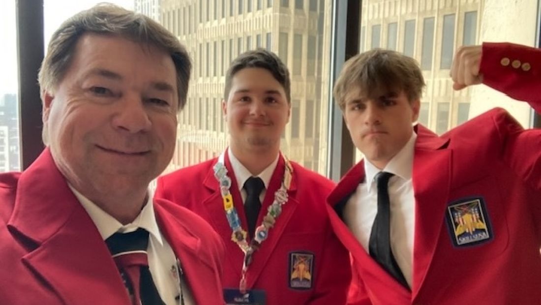 tom and two students taking a selfie