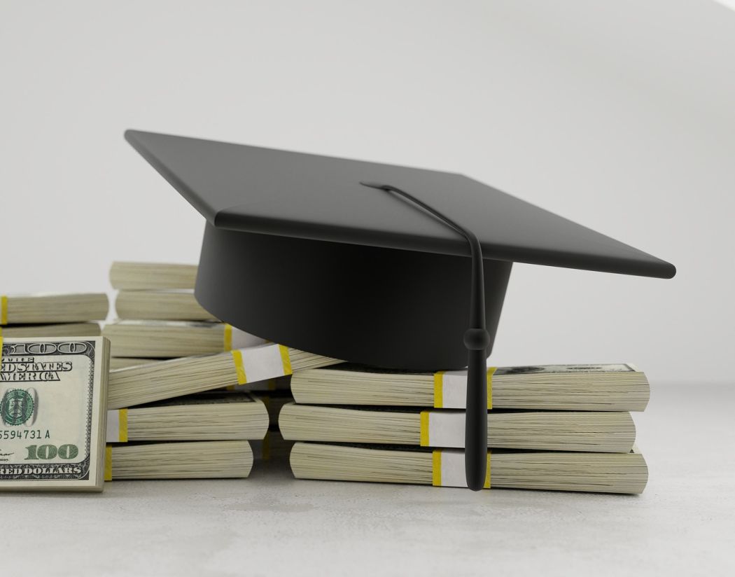 100 dollar bills with grad cap