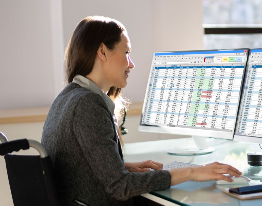 Woman in wheelchair with spreadsheets