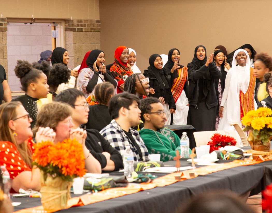 students cheering at Multicultural night