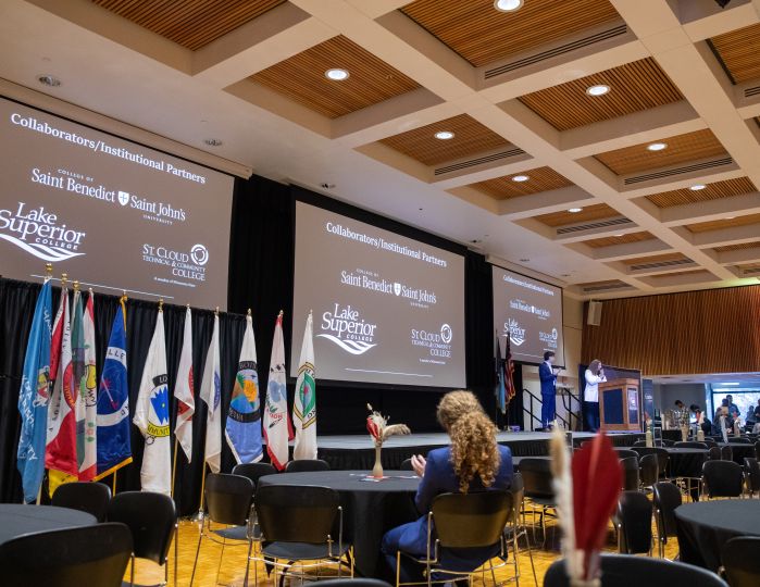 college logo on screen in SCSU ballroom