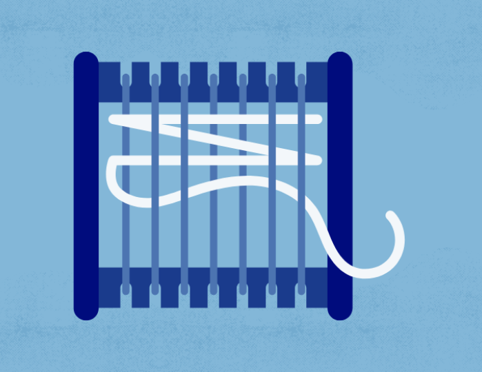 a loom with white yarn 