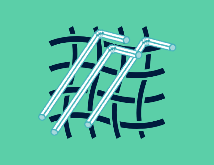 Plastic straws on a woven background