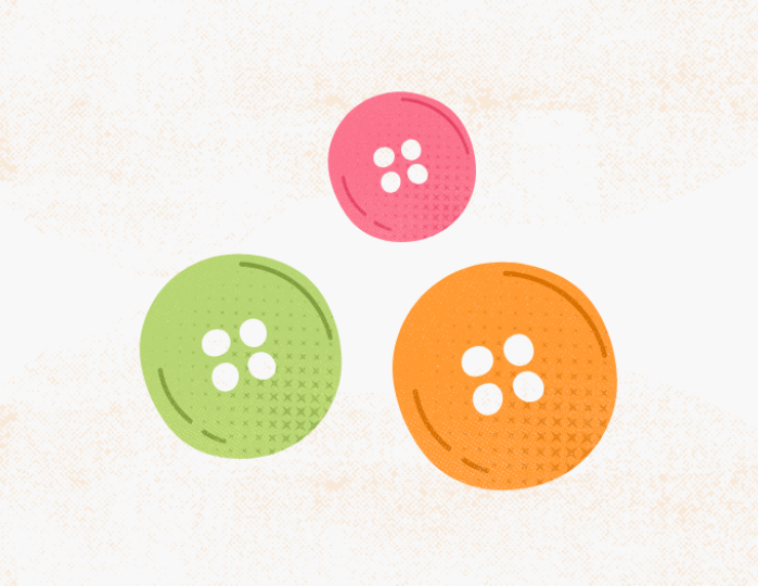 three buttons varying in size and color