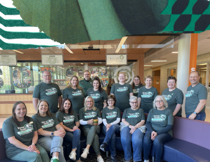 SCTCC staff smiling for group photo for mental health month