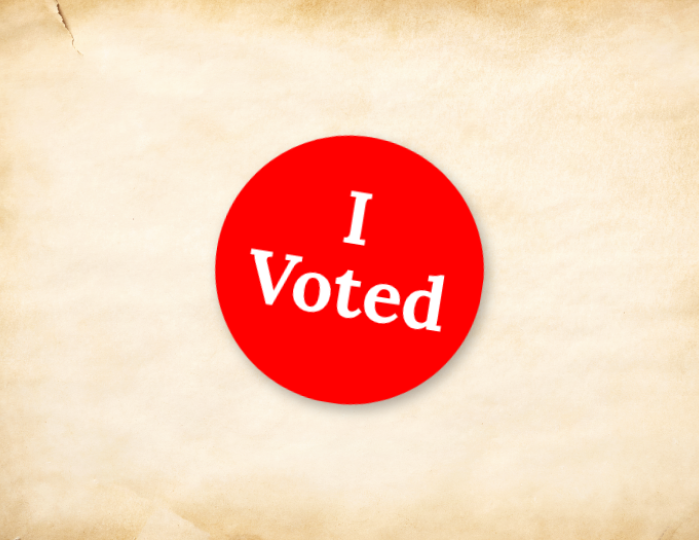 red I voted sticker on old paper background
