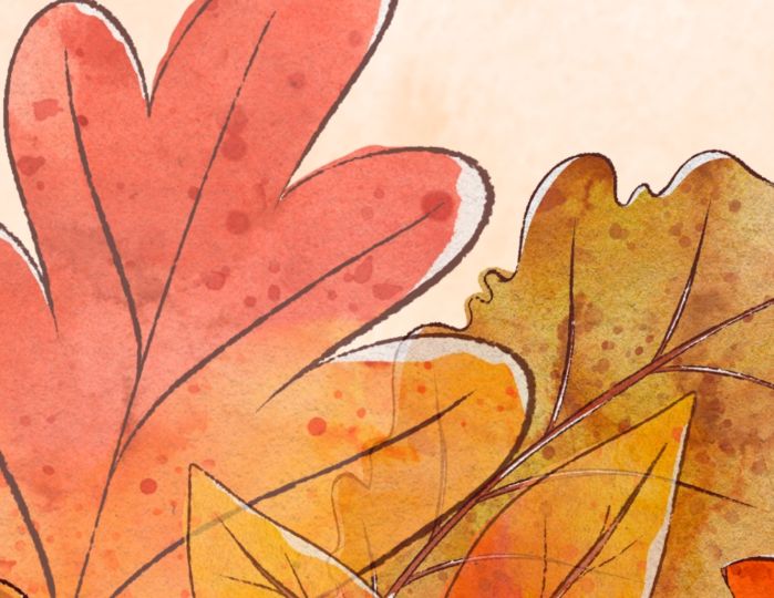 Aututmn leaves against a cream background