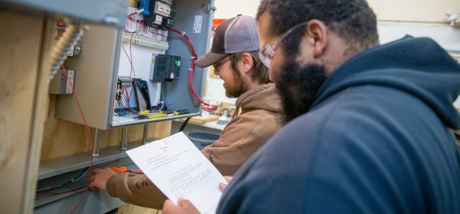 Electrical students working with wires