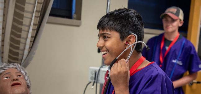 camper listening to stethoscope 