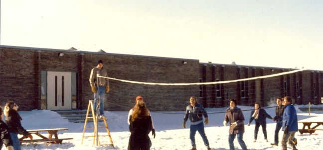 80s students playing volleyball in the snow
