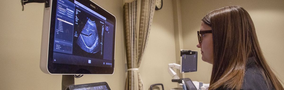 student looks at screen while scanning