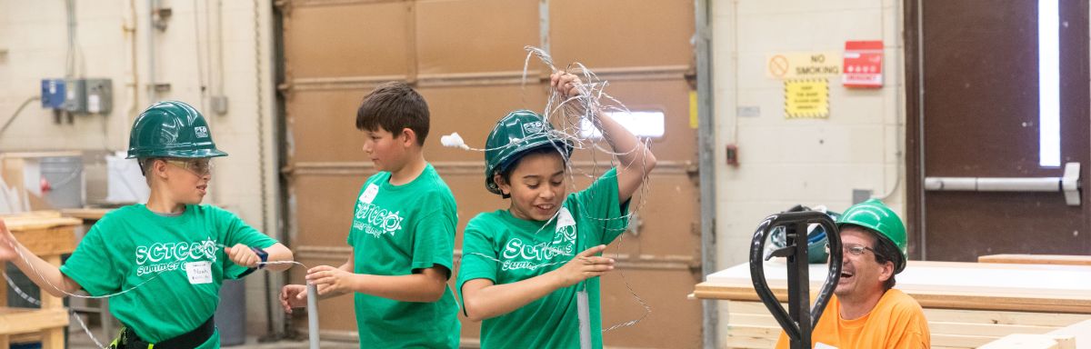 students doing mock electrical wire threading activity