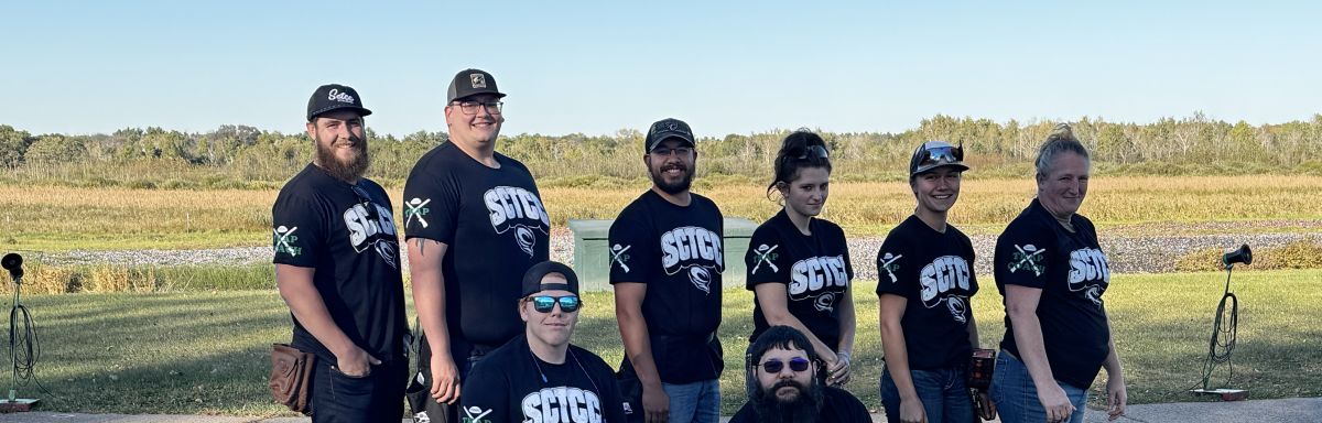 Trap team posing for the camera in two rows