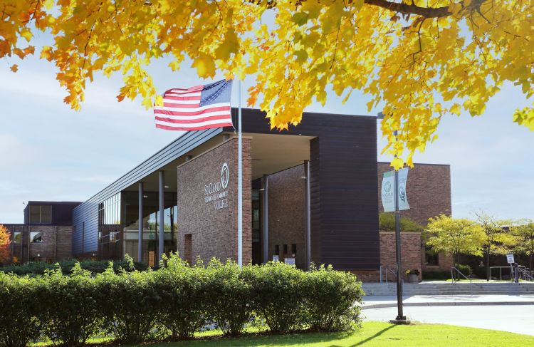 SCTCC main entrance with yellow leaves in forground