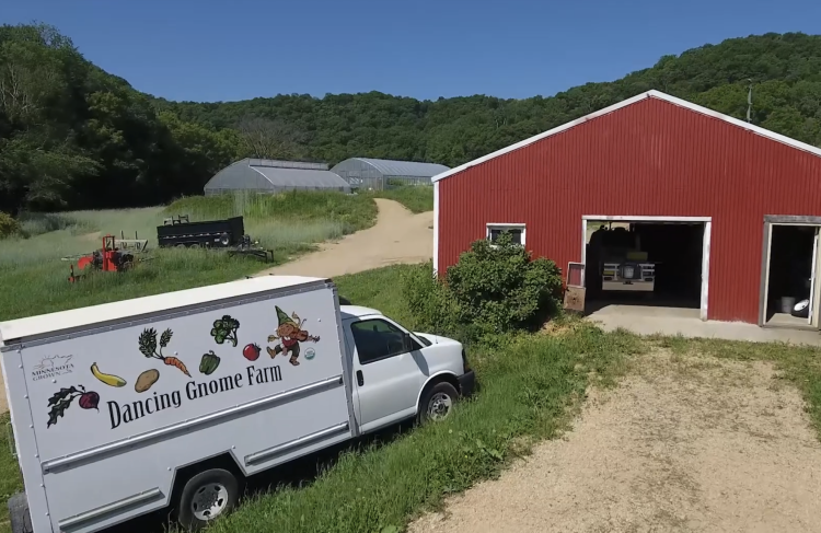 drone shot of barn and truck