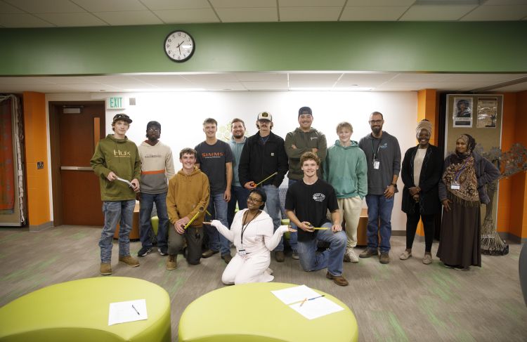 group of electrical students and MCC staff posing for camera