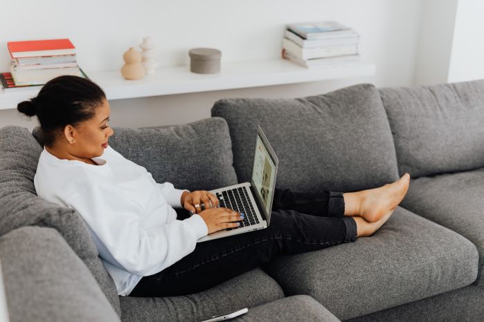 online student on couch