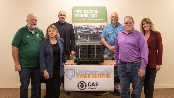 Brian Volkmuth, Jennifer Erickson, Daniel Larson, Ryan Salner, Dave Lerch, Lori Kloos pose with the server