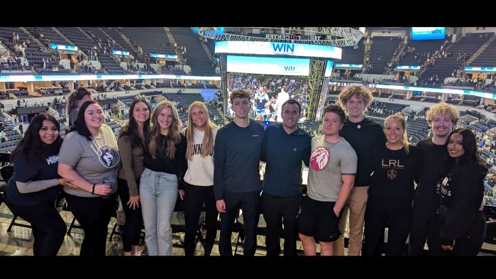 Group of DECA students at the Timerberwolves game