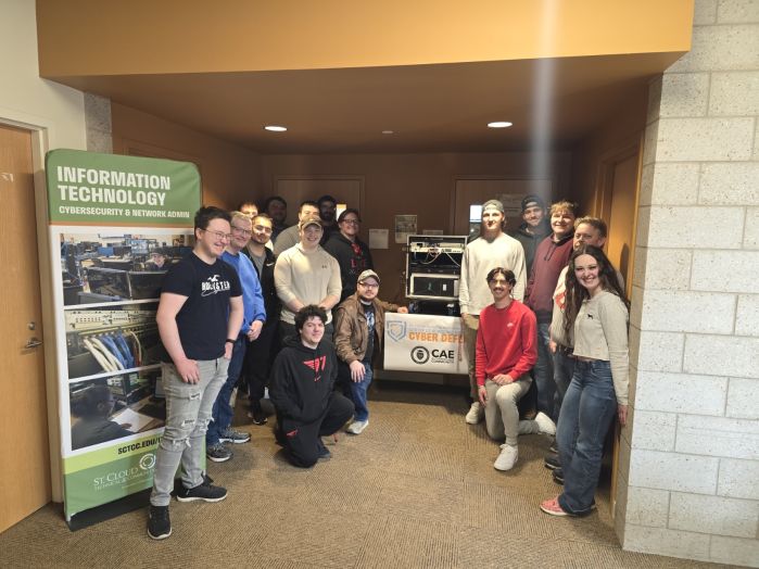 Group of SCTCC cyber students around the mobile lab