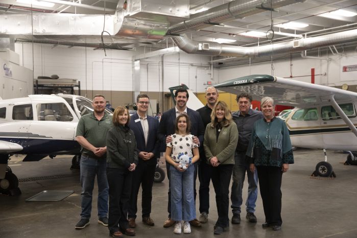 group photo of legislators and SCTCC folks in front of the airplanes