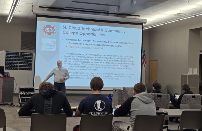 Brian Volkmuth in front of HS students presenting