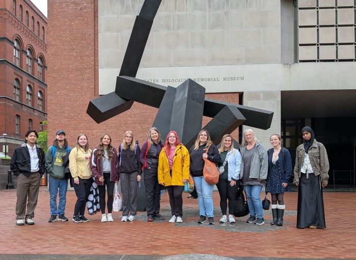 Kathy and students outside museum