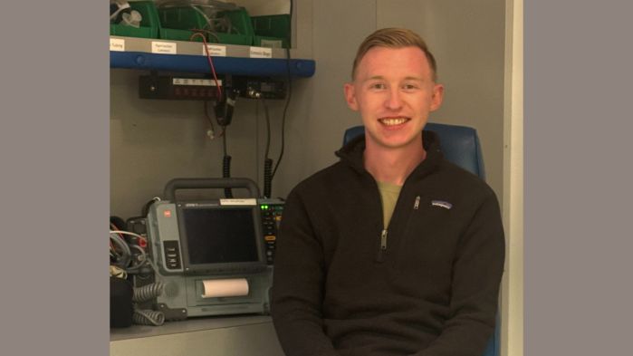 Connor Sturges sitting in an ambulance