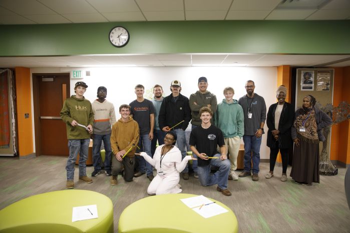 group of electrical students and MCC staff posing for camera