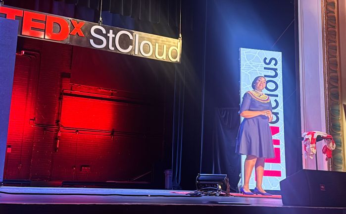 Njeri on stage during her TedX presentation