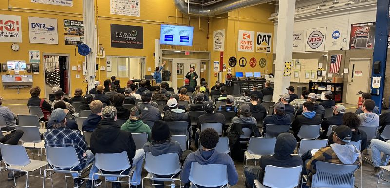 Group of students in chairs watching a presenter