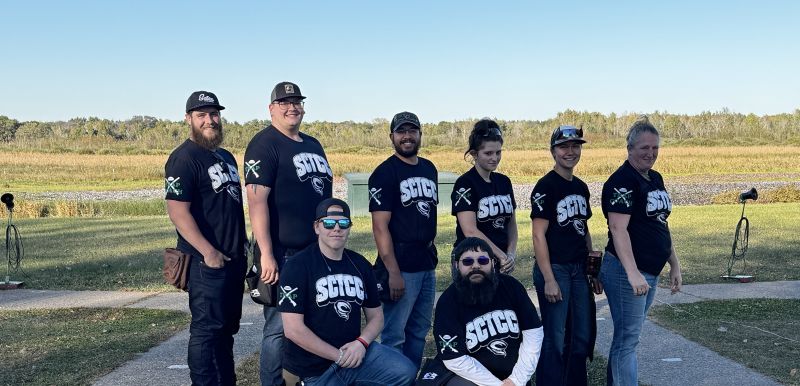 Trap team posing for the camera in two rows