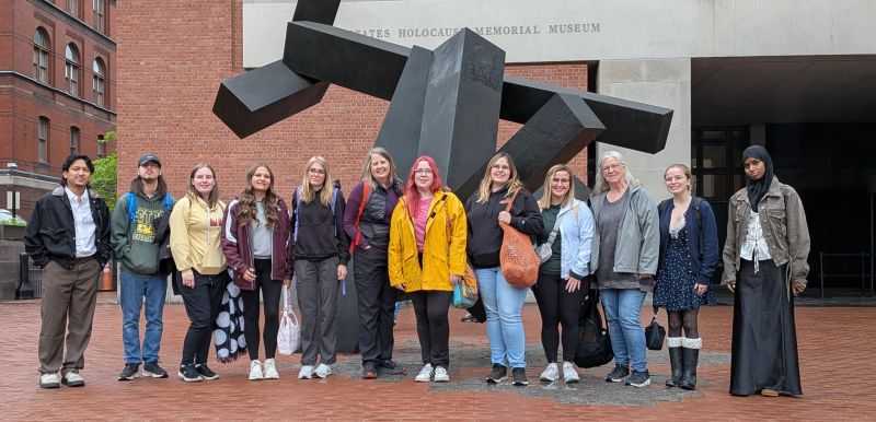Kathy and students outside museum