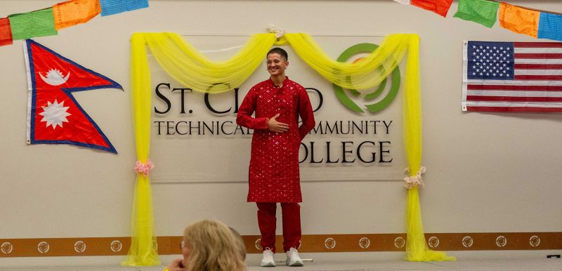 Aveen on stage in the Commons during Teej