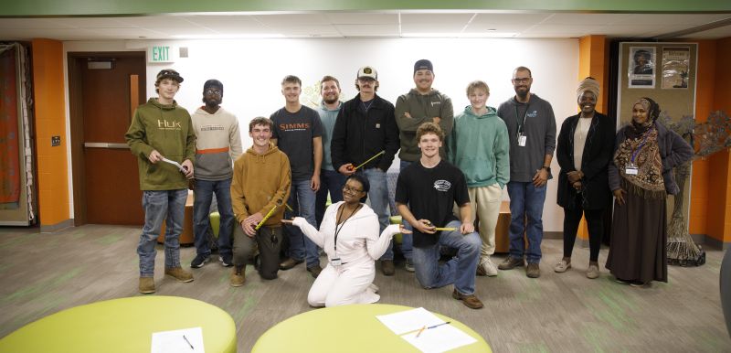 group of electrical students and MCC staff posing for camera