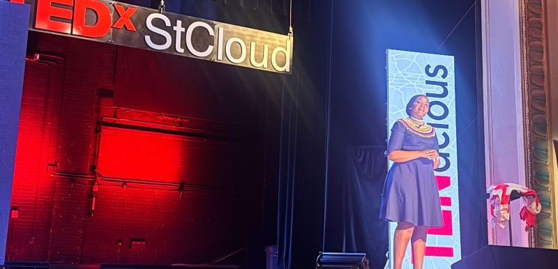 Njeri on stage during her TedX presentation