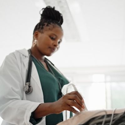 Echocardiologist scanning a patient