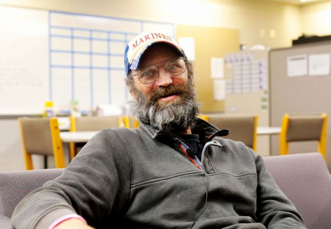 chad sitting in a chair in the veterans center, looking relaxed