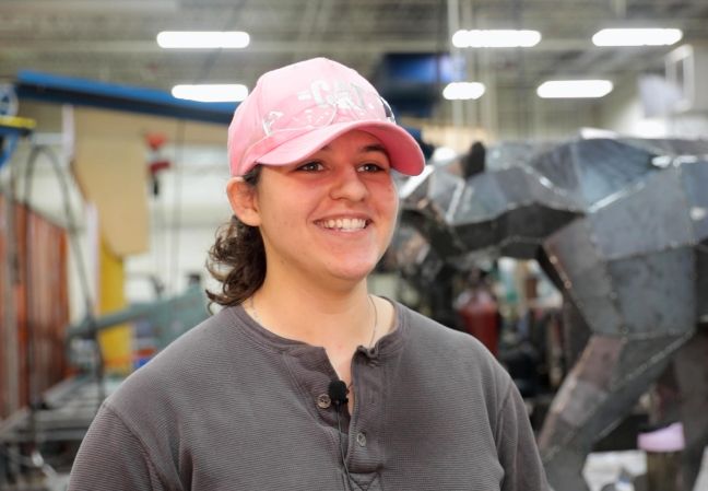 Jasslyn smiling in front of panther