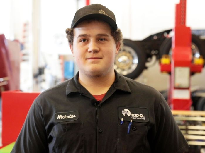 Nicholas Sakry in RDO uniform standing in MHT lab